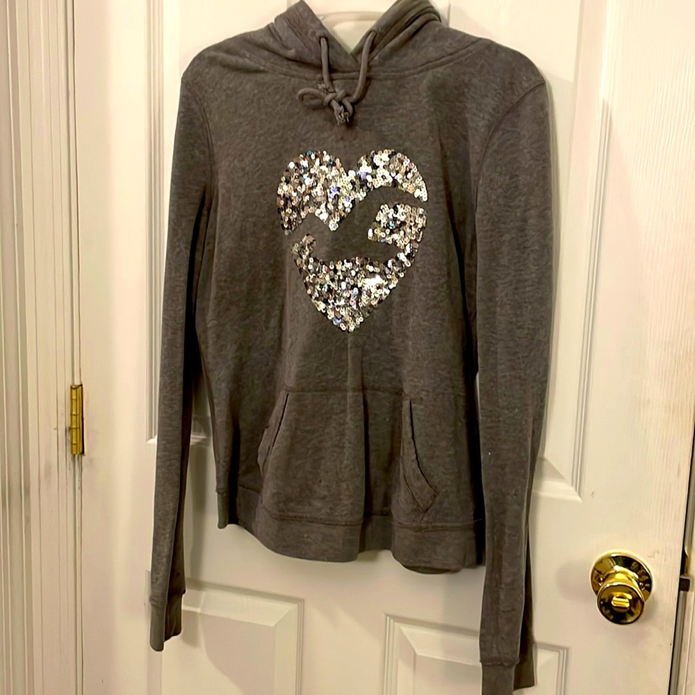 Grey Hollister hoodie with sequin heart/Hollister emblem outline, size L